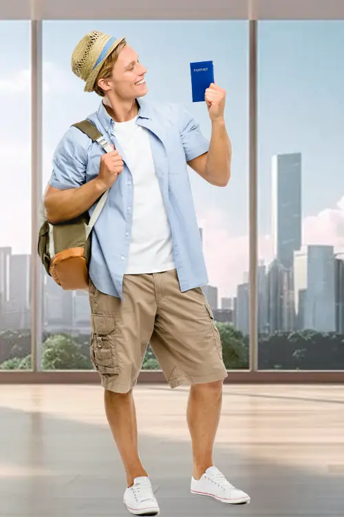 a happy man with backpack wearing hat and holding passport