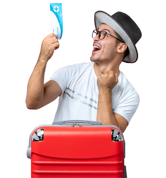 an excited man wearing hat and holding flight ticket near to luggage