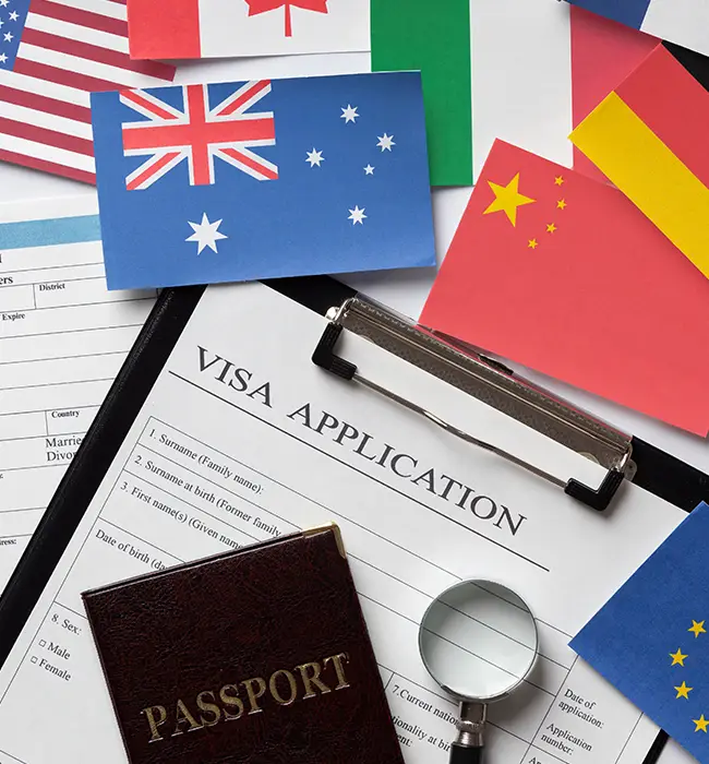 Visa application form with a magnifying glass, passport, and assorted international flags.